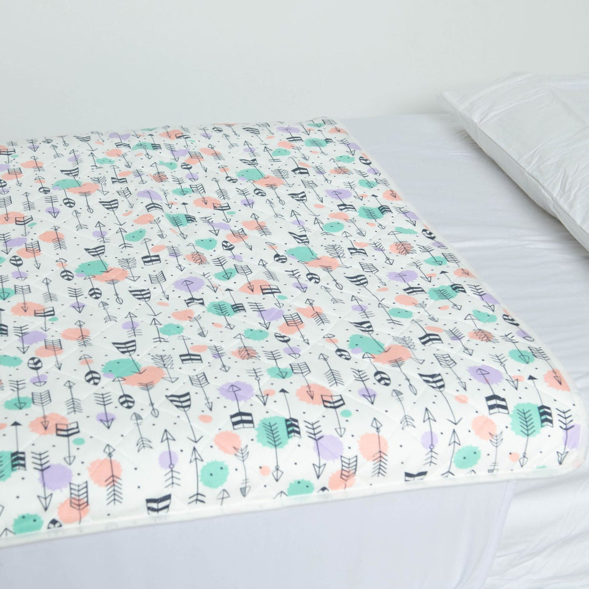 Close up of the Polka Arrow pattern on a Bed Mat that is used for bed wetting or gastro outbreaks. 