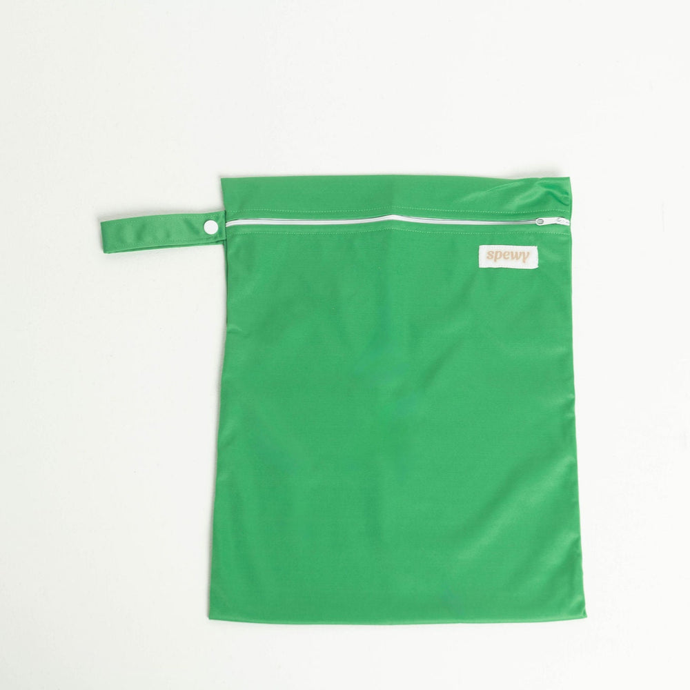 
                      
                        Green laundry bag with a white zipper on a light gray background
                      
                    