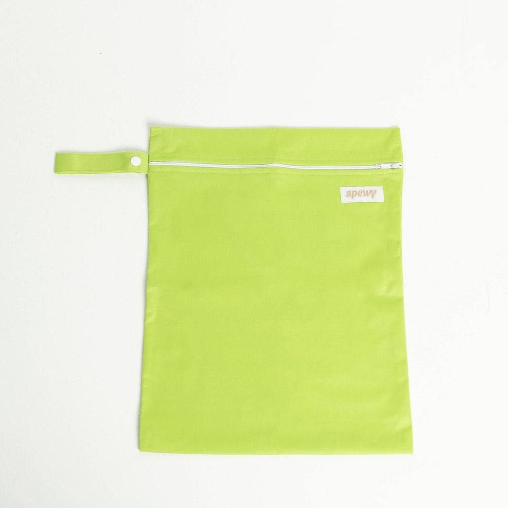 
                      
                        Green laundry bag with a white zipper on a light gray background
                      
                    