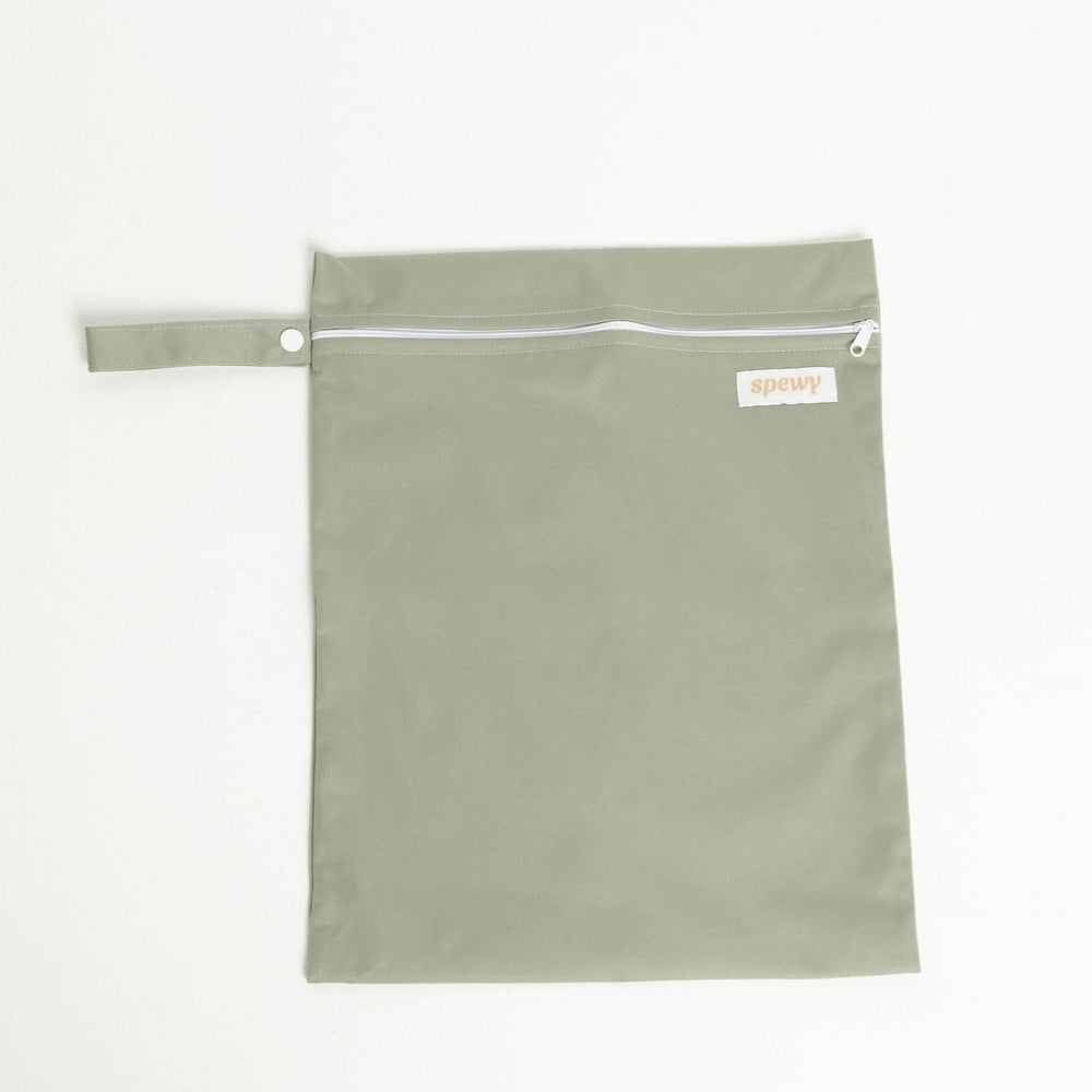 
                      
                        Grey laundry bag with a white zipper on a light gray background
                      
                    