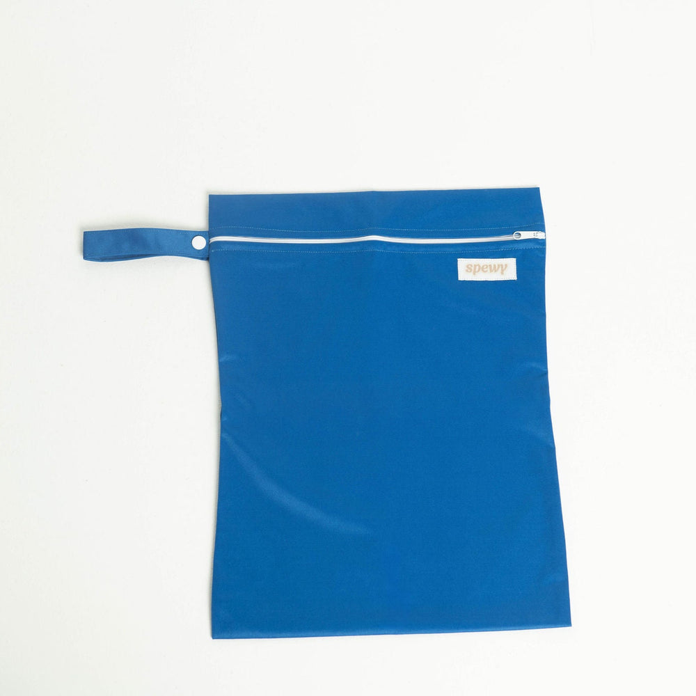 
                      
                        Navy laundry bag with a white zipper on a light gray background
                      
                    